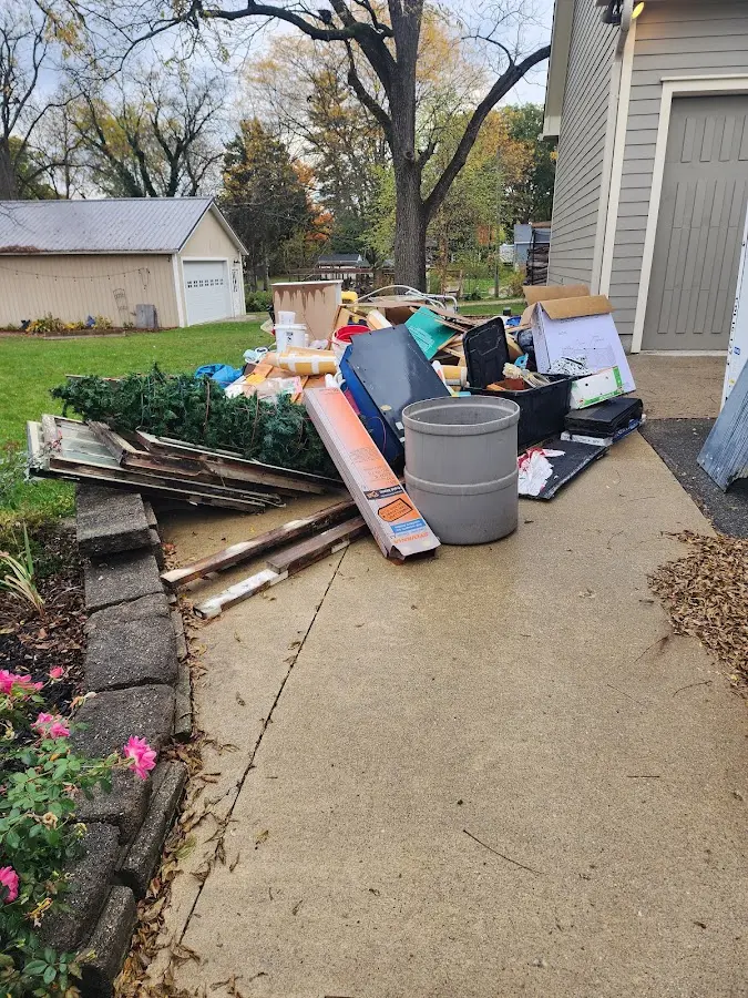 Dumpster being loaded with debris for Commercial Dumpster Rental in Swansea